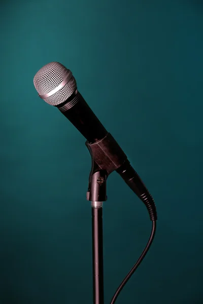 Microphone on stand on green background — Stock Photo, Image