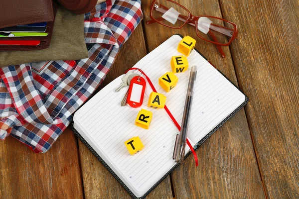 Set of tourist with word Travel on wooden planks background — Stock Photo, Image