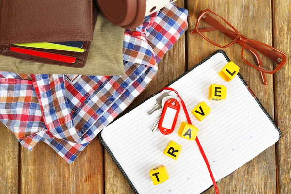 Set of tourist with word Travel on wooden planks background — Stock Photo, Image