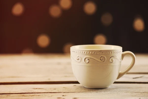 Cup of coffee on table on brown background — Stock Photo, Image