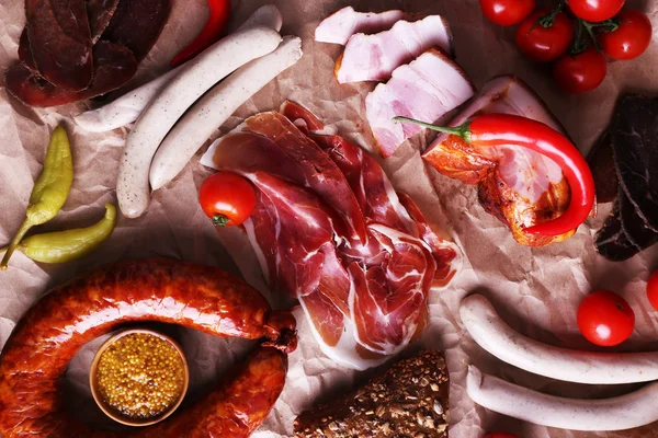 Assortment of deli meats on parchment background — Stock Photo, Image
