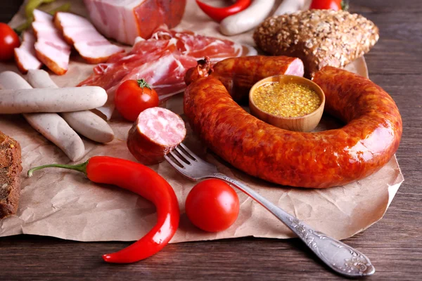 Assortment of deli meats on parchment, closeup — Stock Photo, Image