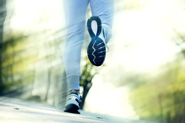 Runner feet on road, outdoors — Stock Photo, Image