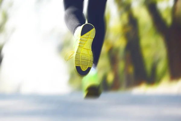 Runner feet on road, outdoors — Stock Photo, Image