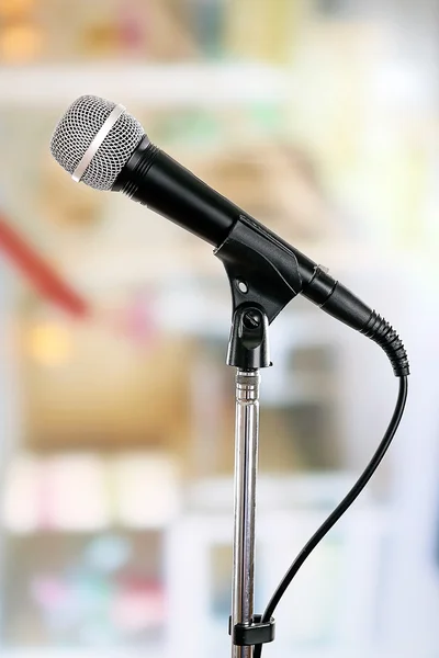 Microphone on stand on light background — Stock Fotó