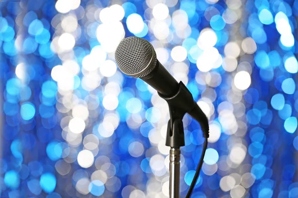 Microphone on stand on blue background — Stock Photo, Image