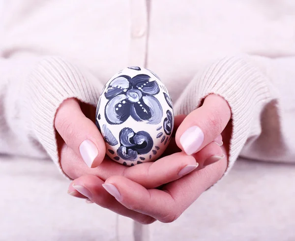 Woman holding Easter egg close up — Stock Photo, Image