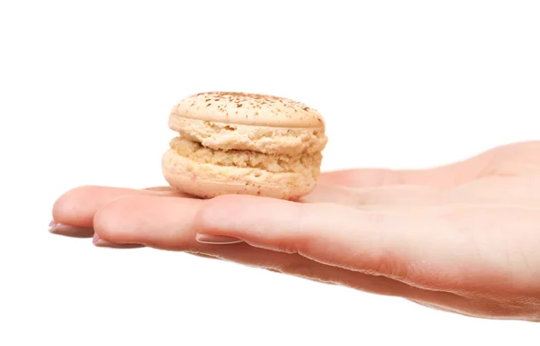 Tasty colorful macaroons in female hand isolated on white — Stock Photo, Image