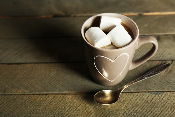 Cup of cocoa with marshmallows on rustic wooden planks background — Stock Photo, Image