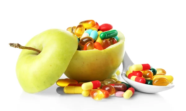 Apple and colorful pills, isolated on white — Stock Photo, Image