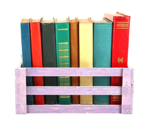 Libros en caja de madera aislados en blanco — Foto de Stock