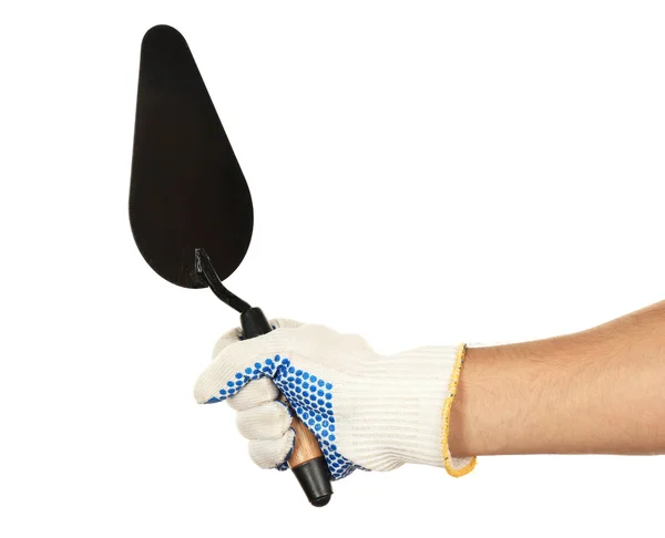 Building trowel in male hand with construction gloves isolated on white — Stock Photo, Image