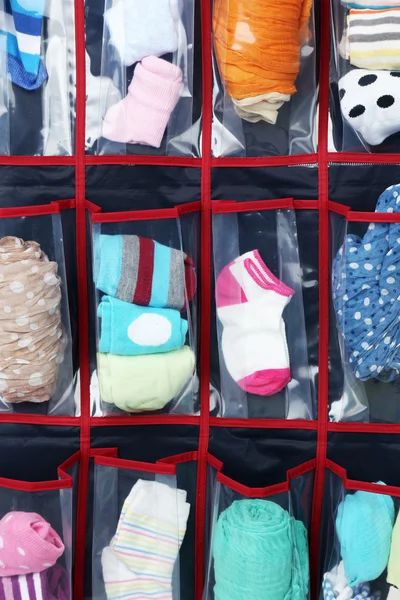 Different socks in hanging bag, closeup view — Stock Photo, Image