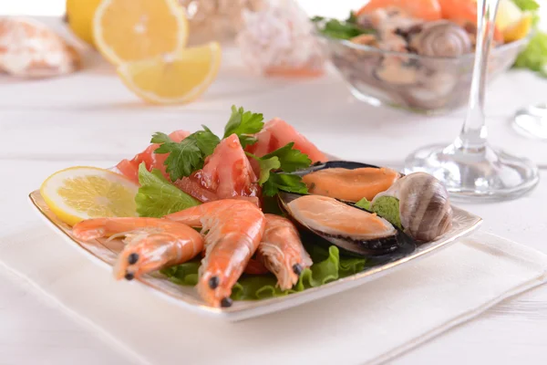 Tasty seafood on plate on table close-up — Stock Photo, Image