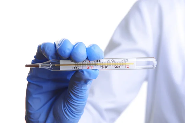 Doctor holding thermometer close up — Stock Photo, Image