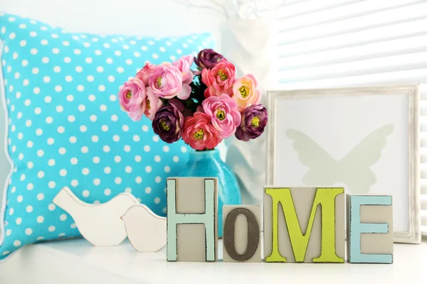 Home in colorful letters in light white interior — Stock Photo, Image
