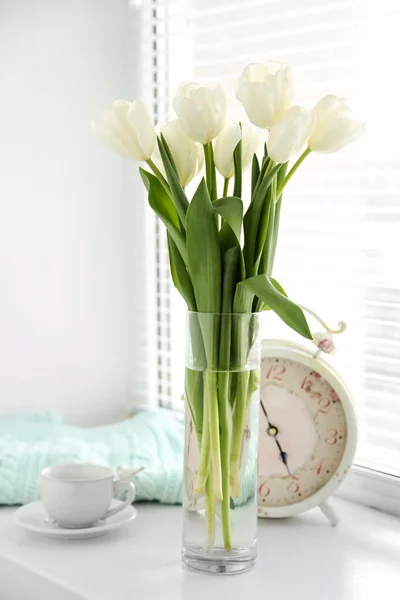 White beautiful tulips in light interior — Stock Photo, Image