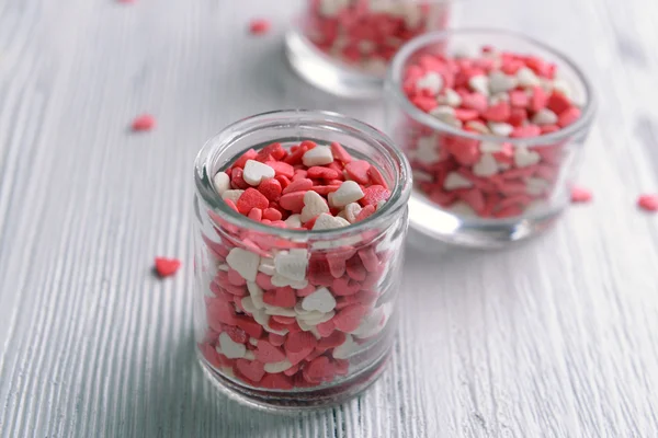 Colorful sprinkles in bowls on table close-up — Stock Photo, Image