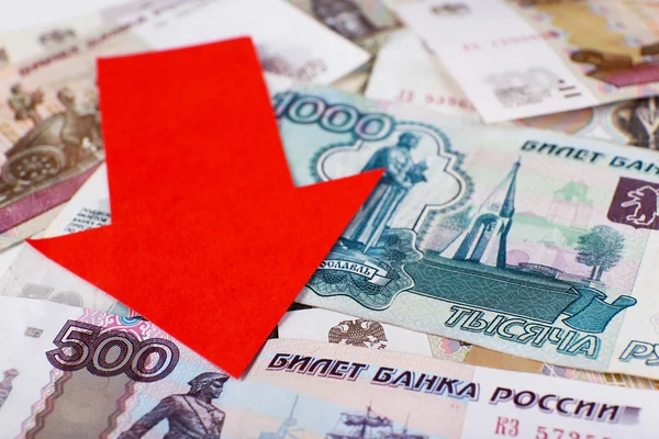 Red arrow on Russian money as depreciation of currency, closeup — Stock Photo, Image