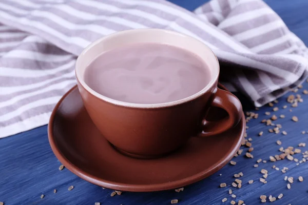 Cup of cocoa with sugar on color wooden background — Stock Photo, Image