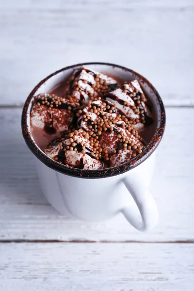 Mug of cocoa with marshmallow on wood background — Stok Foto