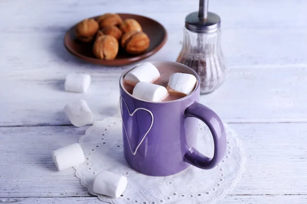 Cup of cocoa with marshmallows and cookies on wooden background — Stock Photo, Image