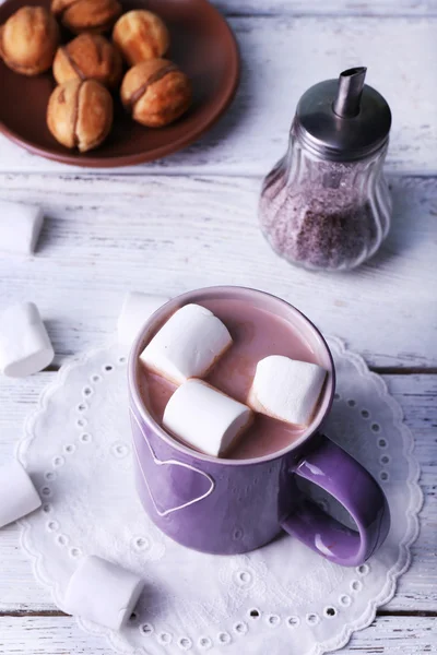 Cup of cocoa with marshmallows and cookies on wooden table, closeup — Stock Photo, Image