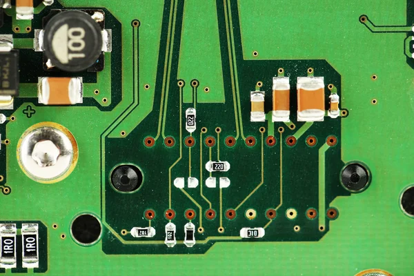 Placa de circuito impreso con muchos componentes eléctricos — Foto de Stock