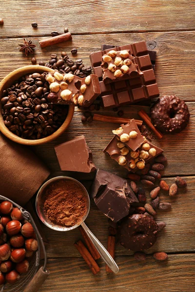 Still life with set of chocolate on wooden table, top view — Stock Photo, Image