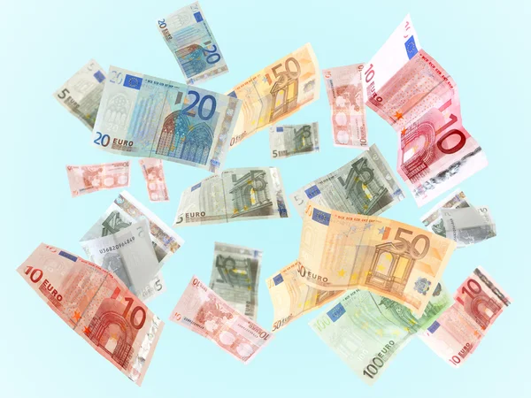 Fliegende Euro-Banknoten auf blauem Hintergrund — Stockfoto