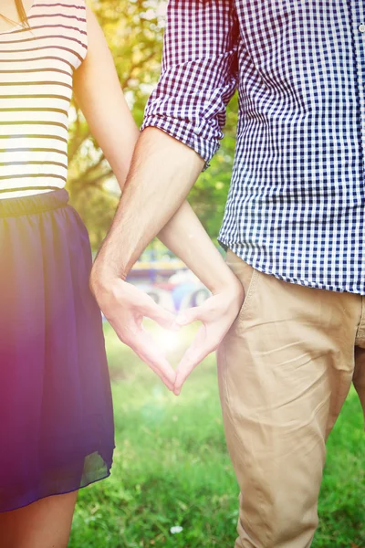 Loving couple holding hands outdoors — Stock Photo, Image