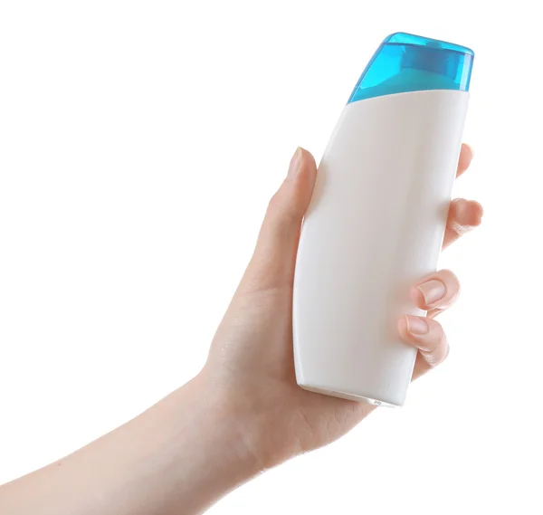 Ręka z butelki kosmetyki na białym tle — Zdjęcie stockowe