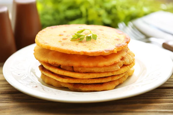 Stack of corn tortillas with stuffing and greens on wooden table background — Stock Photo, Image