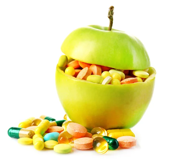 Apple and colorful pills, isolated on white — Stock Photo, Image