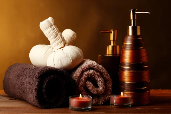 Composition of spa treatment on wooden table, on dark color background — Stock Photo, Image