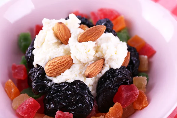 Dessert with prunes with dried fruits in bowl, macro view — Stock Photo, Image