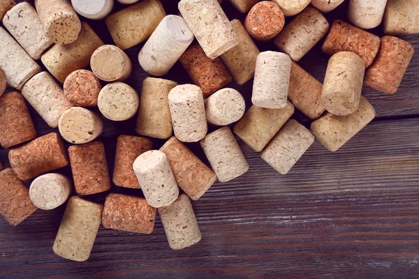 Wine corks on rustic wooden planks background — Stock Photo, Image