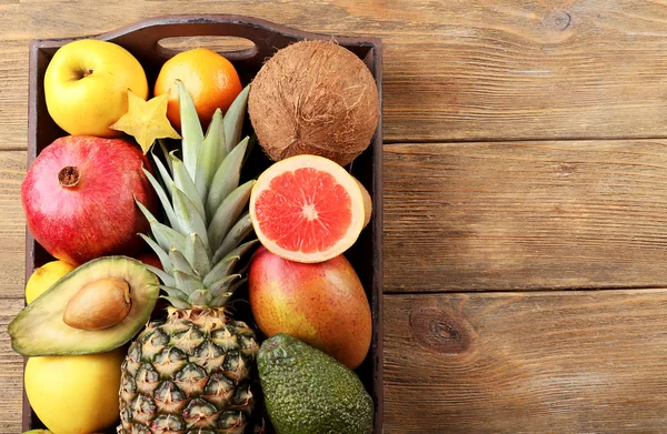 Assortment of fruits on wooden table — Stock Photo, Image