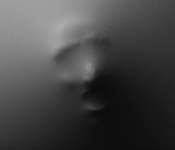 Schreeuwen menselijk gezicht te drukken door middel van stof als horror achtergrond — Stockfoto