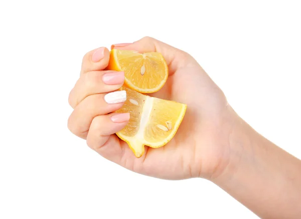 Female hand squeezing lemon isolated on white — Stock Photo, Image