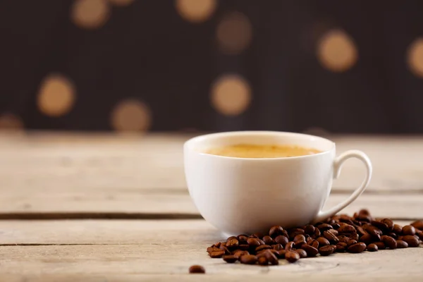 Cup of coffee on table on brown background — Stock Photo, Image