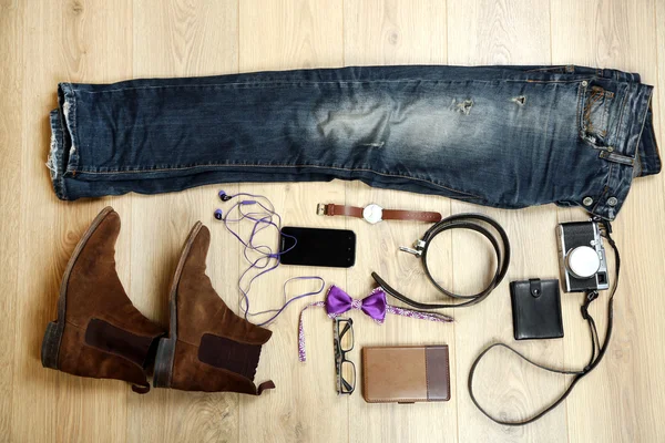 Still life of casual man on wooden background — Stock Photo, Image