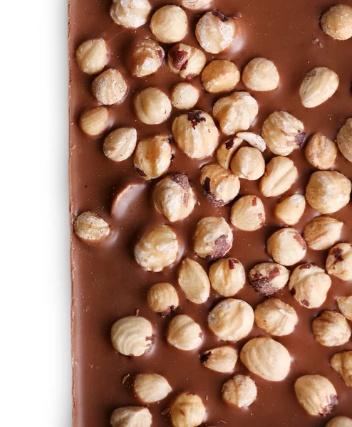 Barra de chocolate con leche y avellanas aisladas en blanco —  Fotos de Stock