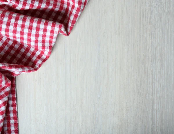 Napkin on wooden table — Stock Photo, Image