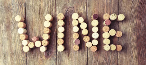 Wine corks on wooden background — Stock Photo, Image