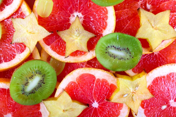 Sliced fruits background — Stock Photo, Image