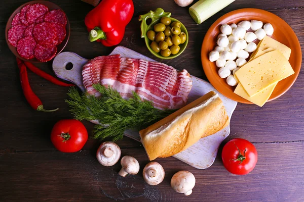 Different products on wooden table close up — Stock Photo, Image