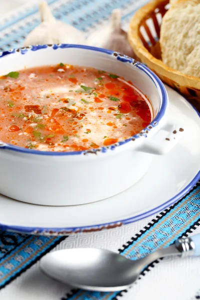 Ukrainian beetroot soup - borscht, on blue napkin, on wooden background — Stock Photo, Image