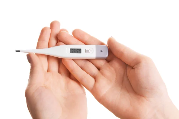 Female hands holding thermometer isolated on white — Stock Photo, Image