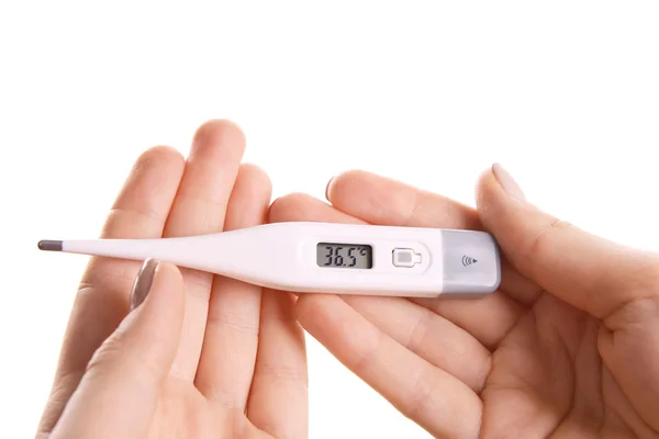 Vrouwelijke handen met thermometer geïsoleerd op wit — Stockfoto